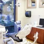 Treatment room with patient chair at {PRACTICE_NAME}