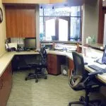 Reception area showing computers and chairs at {PRACTICE_NAME}